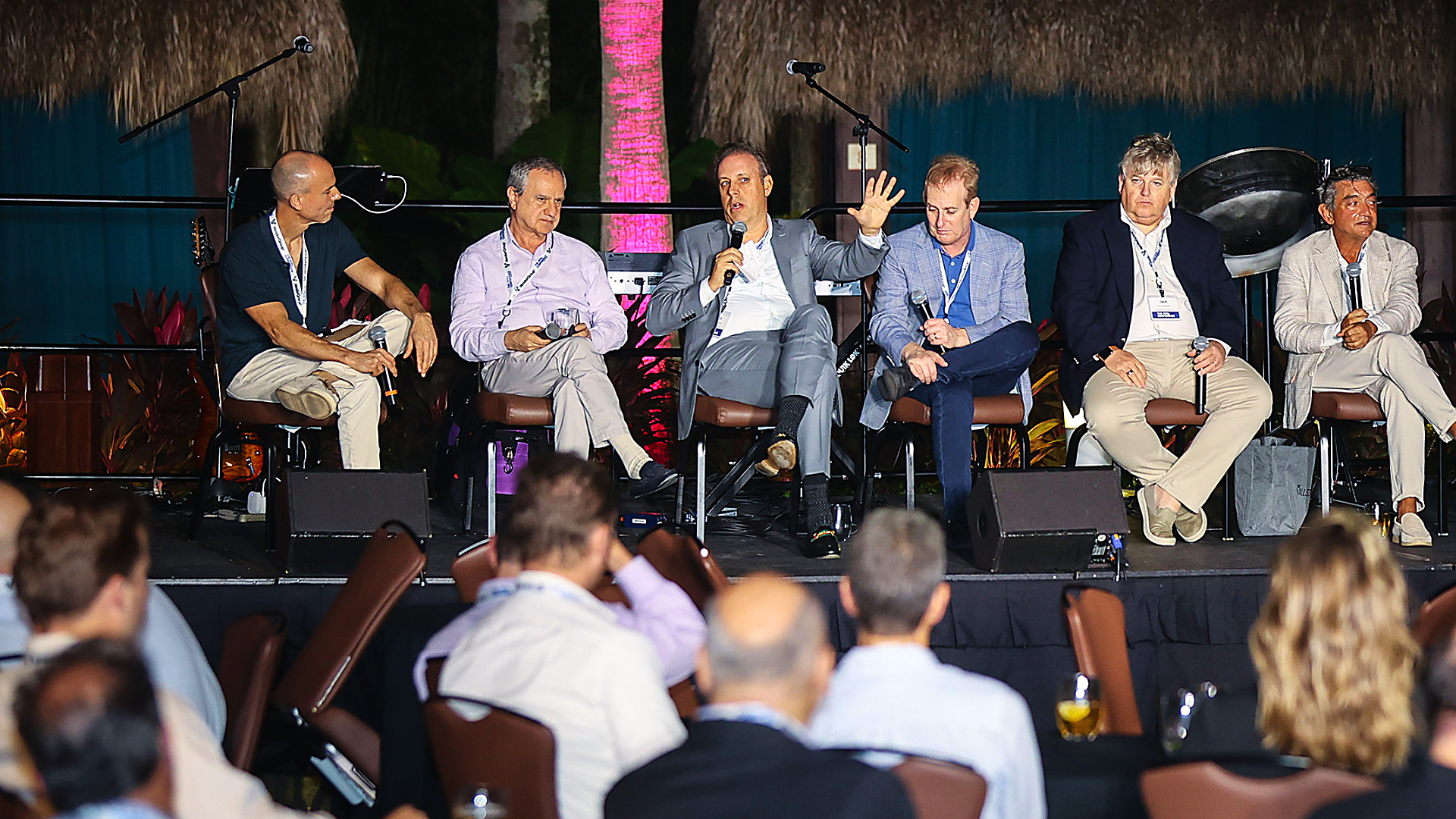 A DealFlow Events panel discussion in front of an audience